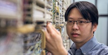 E-Comm technician working on server