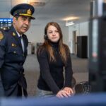 Call taker Lauretta Lockwood (right) demonstrates a workstation to Victoria Police Chief Constable Del Manak on March 6, 2019. Credit: Province of BC