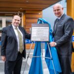 CRD Board Chair Colin Plant (left) and BC Minister of Public Safety and Solicitor General Mike Farnworth unveil a plaque for the new South Island 9-1-1 Police Dispatch Centre. Credit: Province of BC.
