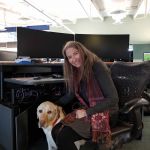 Lynn Gifford, a specialist in trauma stewardship, joins E-Comm as its full-time Workplace Wellness manager along with certified assistance dog Koltan, a four-year-old Yellow Labrador Retriever.